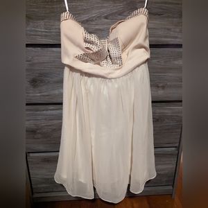 Strapless cream dress with full skirt and rhinestones